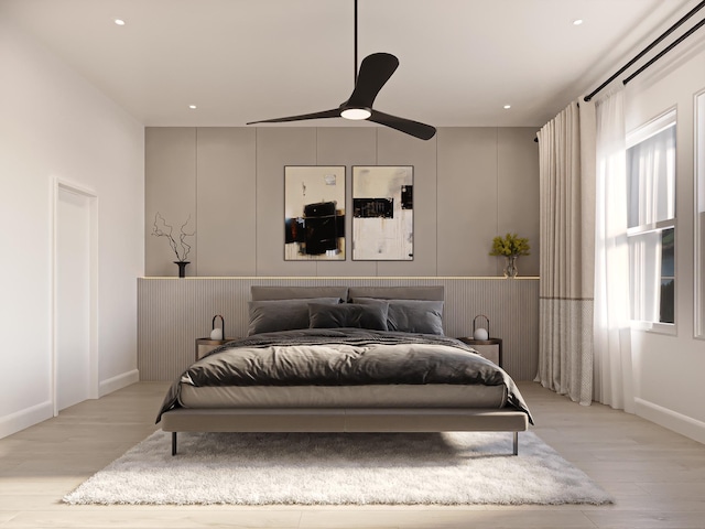 bedroom with light hardwood / wood-style flooring and ceiling fan