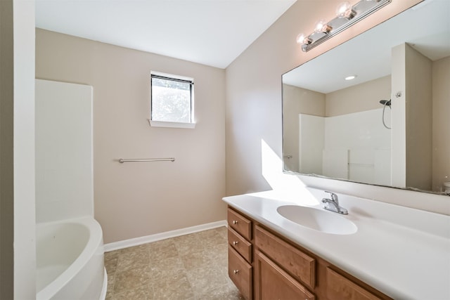 bathroom featuring shower / tub combination and vanity