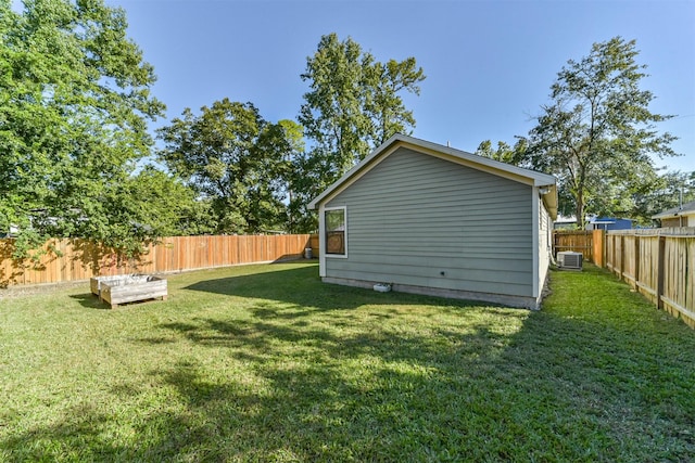 view of yard featuring central AC unit