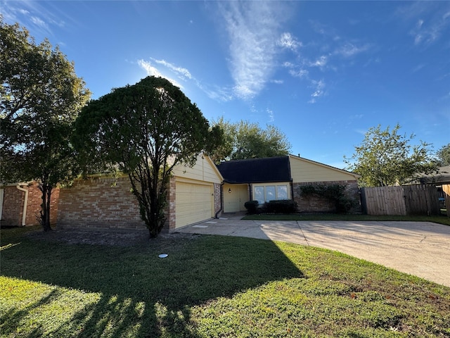 single story home with a front yard and a garage