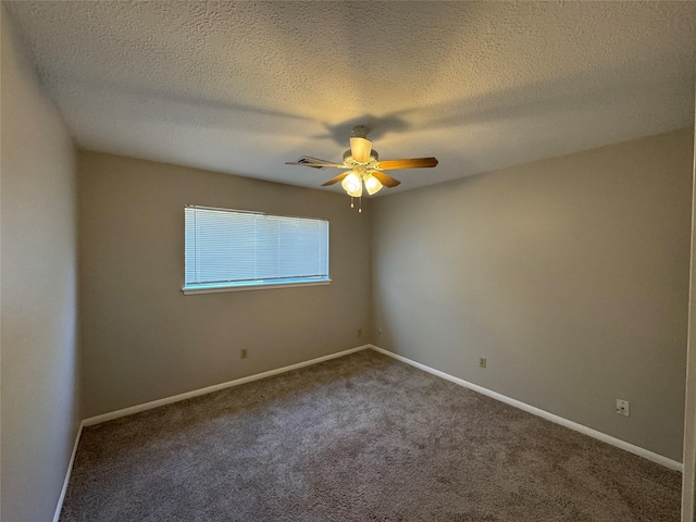 carpeted empty room with a textured ceiling