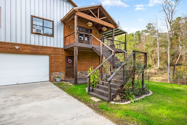 view of front of house with a front yard and a garage