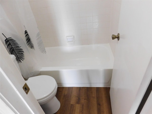 bathroom with wood-type flooring and toilet