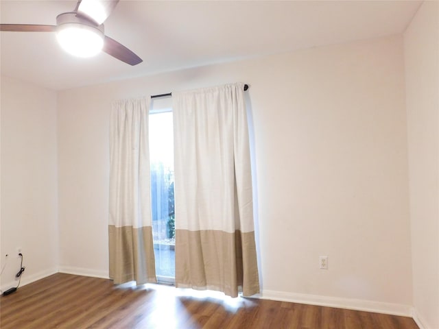 unfurnished room with hardwood / wood-style flooring and ceiling fan