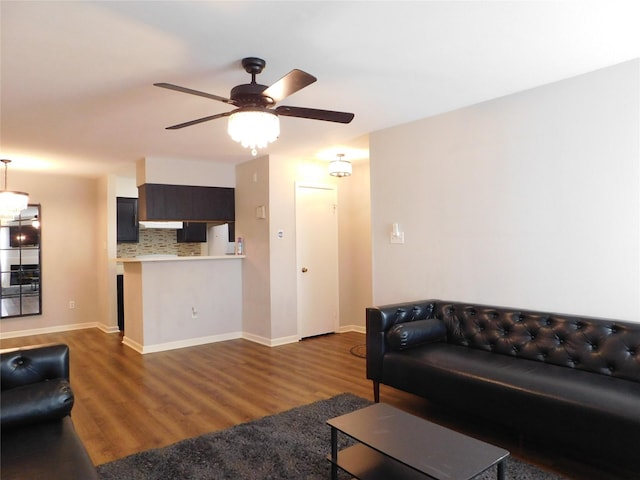 living room with hardwood / wood-style floors and ceiling fan