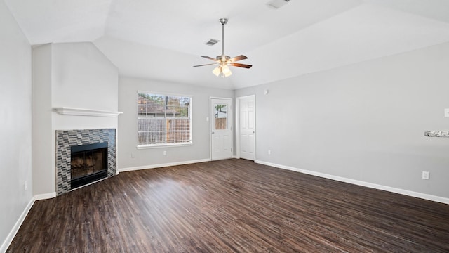 unfurnished living room with a fireplace, vaulted ceiling, ceiling fan, and dark wood-type flooring