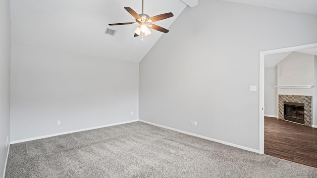 bonus room with a tiled fireplace, carpet floors, high vaulted ceiling, and ceiling fan