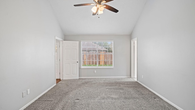 carpeted empty room with ceiling fan and vaulted ceiling