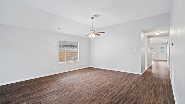 unfurnished room with ceiling fan and dark wood-type flooring