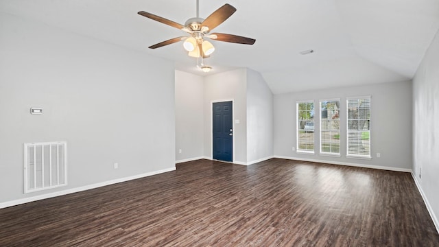 spare room with ceiling fan, dark hardwood / wood-style flooring, and vaulted ceiling