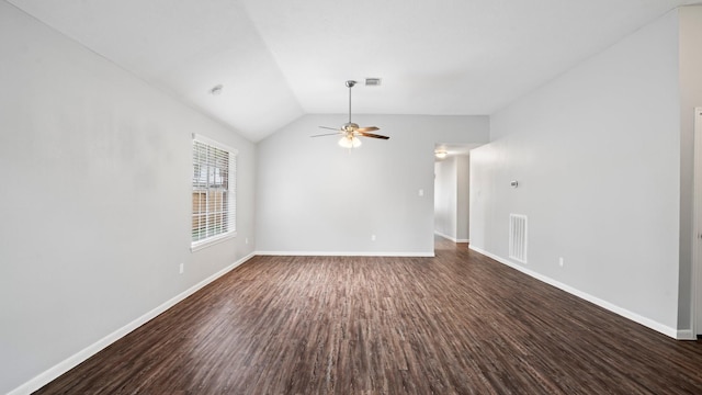 unfurnished room with ceiling fan, dark wood-type flooring, and lofted ceiling