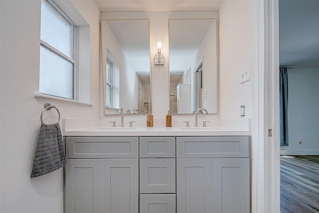 bathroom featuring vanity and wood-type flooring