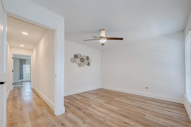 unfurnished room featuring ceiling fan and light hardwood / wood-style floors