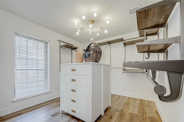 walk in closet featuring light hardwood / wood-style floors