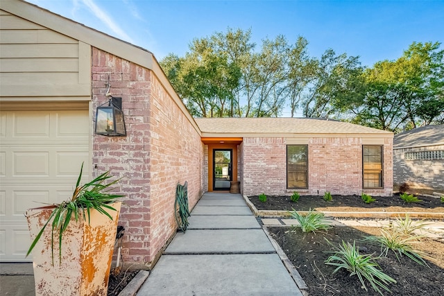 entrance to property featuring a garage