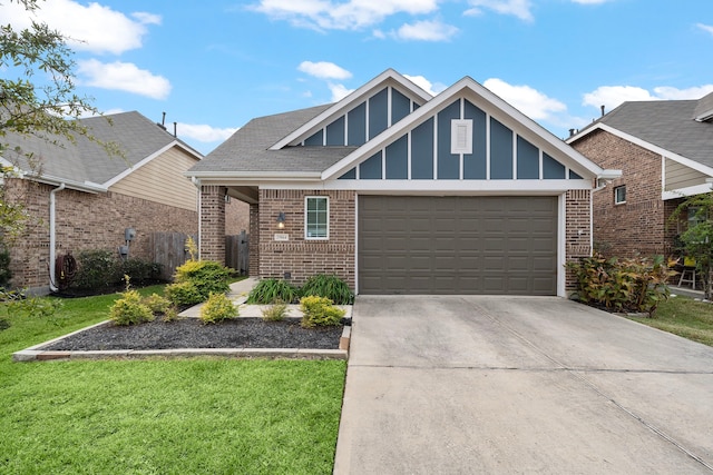 view of front of house with a front yard and a garage