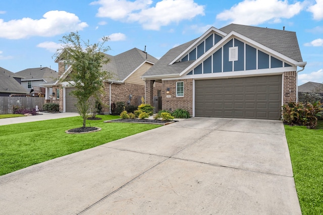 view of front of house featuring a front yard and a garage