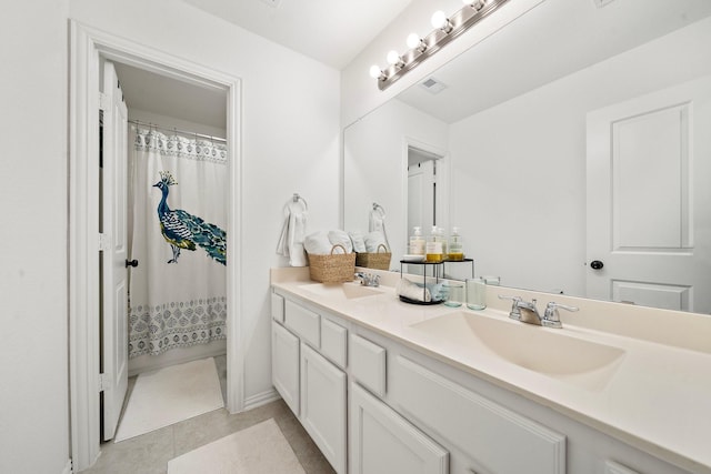 bathroom with tile patterned flooring, vanity, and a shower with shower curtain