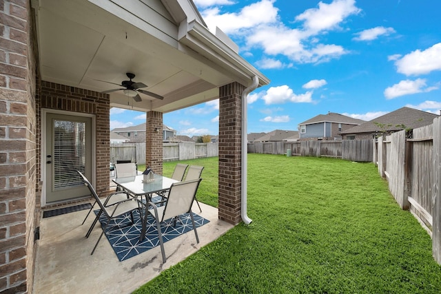 view of yard with a patio area and ceiling fan