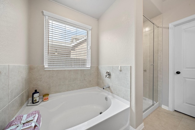 bathroom with tile patterned floors and plus walk in shower