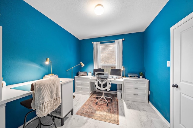 office area featuring a textured ceiling