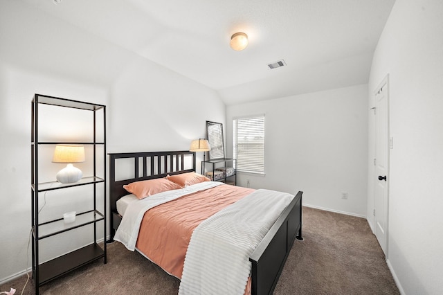 carpeted bedroom featuring vaulted ceiling