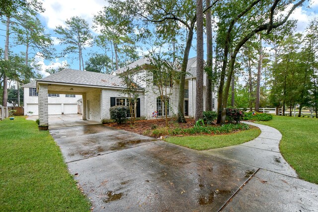 view of front of house featuring a garage and a front lawn