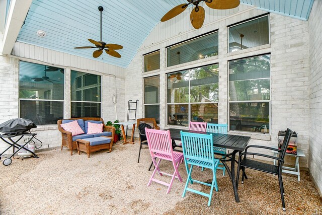 view of patio / terrace with ceiling fan, an outdoor hangout area, and grilling area