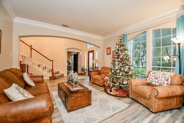 living room with ornamental molding and hardwood / wood-style flooring