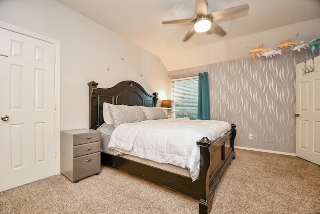 bedroom featuring carpet floors, vaulted ceiling, and ceiling fan