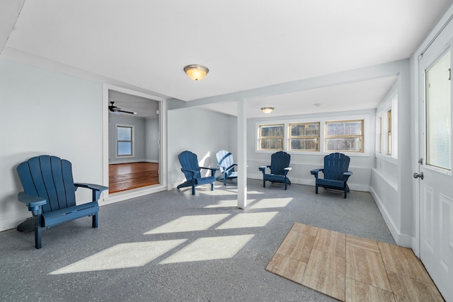 sitting room featuring ceiling fan