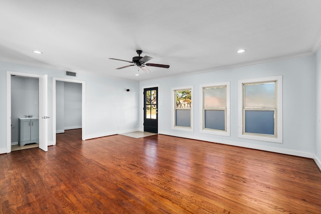 unfurnished room featuring ceiling fan, dark hardwood / wood-style floors, and ornamental molding