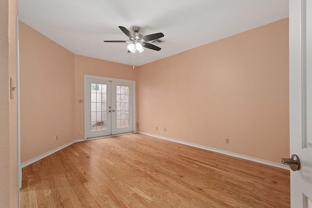 unfurnished room with ceiling fan, french doors, and light hardwood / wood-style floors