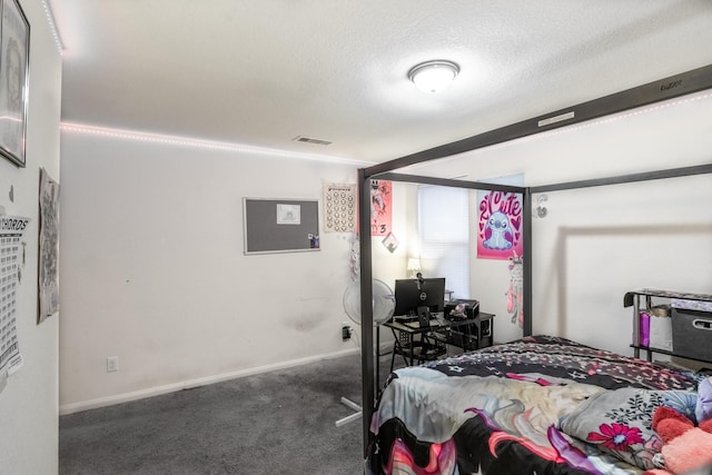 carpeted bedroom featuring a textured ceiling