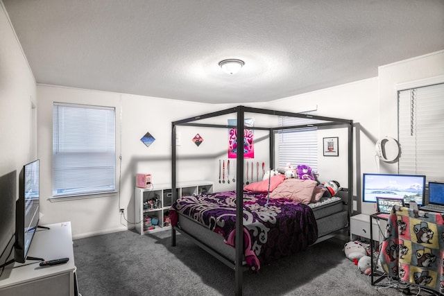 bedroom featuring carpet flooring and a textured ceiling