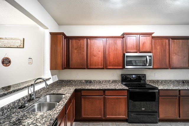 kitchen featuring dark stone counters, sink, a textured ceiling, black / electric stove, and light tile patterned flooring