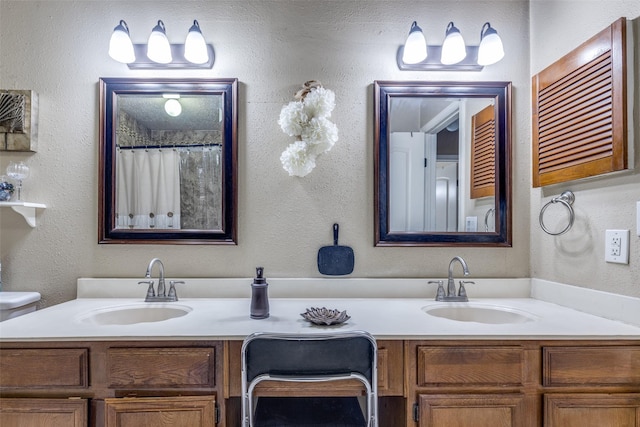 bathroom featuring vanity, curtained shower, and toilet