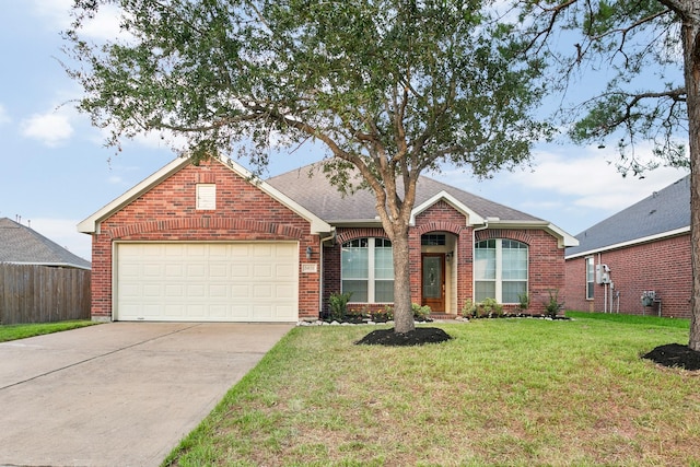 ranch-style house featuring a front yard and a garage