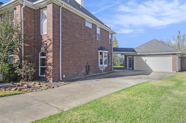 view of home's exterior with a lawn and a garage