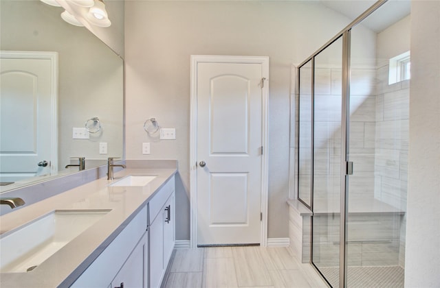 bathroom with vanity and an enclosed shower