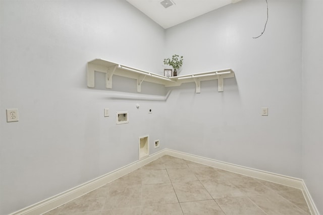 laundry area featuring gas dryer hookup, hookup for a washing machine, electric dryer hookup, and light tile patterned flooring