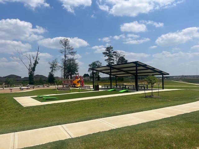 view of home's community with a playground, a lawn, and a gazebo