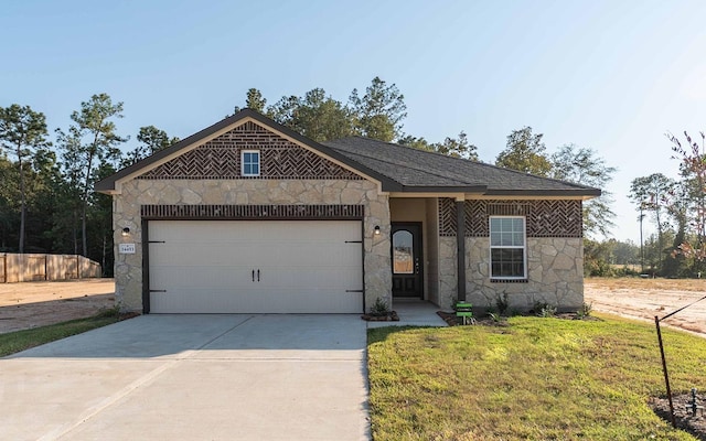 view of front facade with a front lawn and a garage