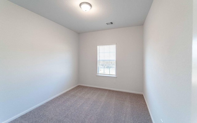 empty room with carpet flooring