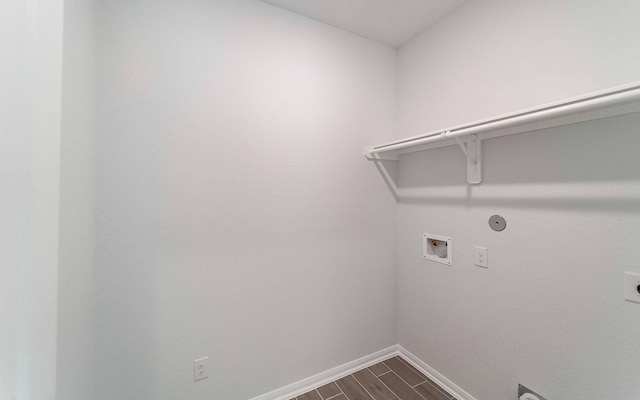 washroom with hookup for an electric dryer, gas dryer hookup, wood-type flooring, and hookup for a washing machine