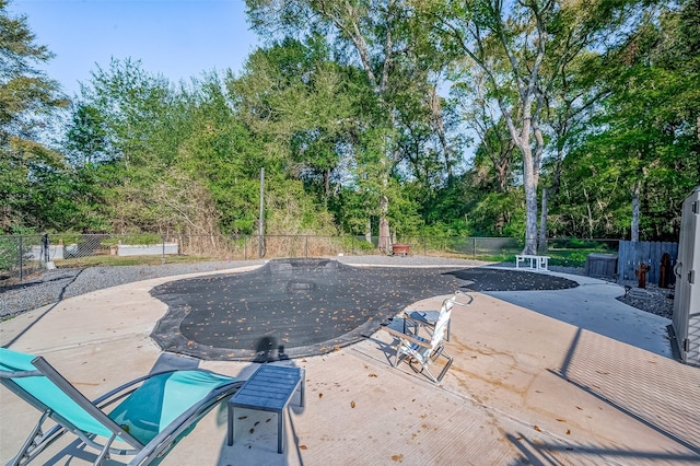 view of swimming pool with a patio area