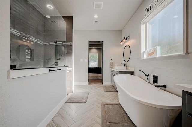 bathroom with vanity, shower with separate bathtub, and parquet flooring