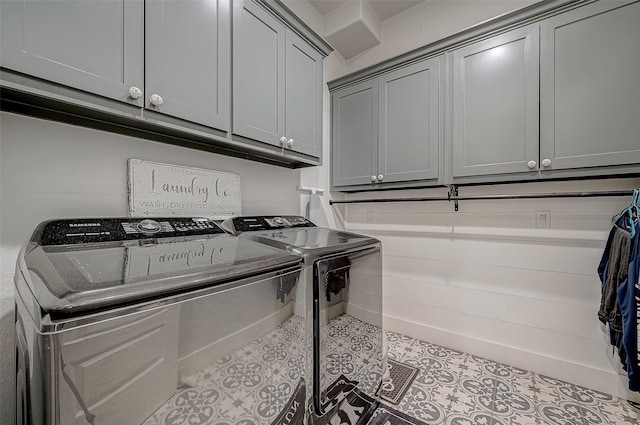 laundry area featuring cabinets and washing machine and clothes dryer