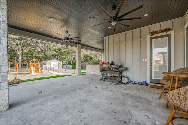 view of patio / terrace featuring a playground and ceiling fan