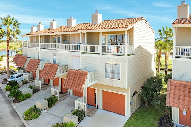 rear view of property featuring a garage